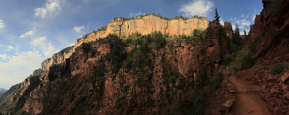 sunrise illuminates rocks above the North Kaibab Trail.