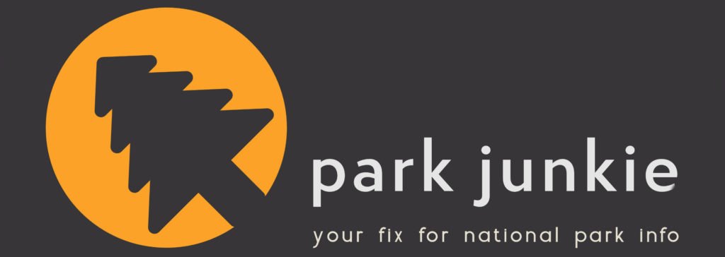 The Park Junkie logo is a an image of a 45 degree leaning evergreen tree silhouetted against a yellow sun on a dark background. 