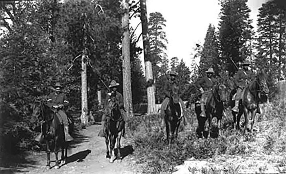 black soldiers on horseback