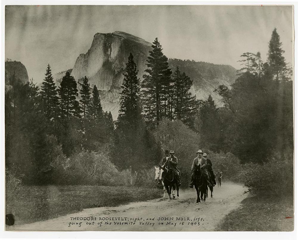 photo of John Muir and president Roosevelt riding horses into Yosemite Valley