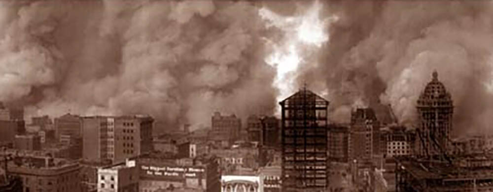 smoke billows from buildings on the San Fransisco skyline in the fire of 1906